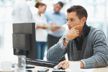 sitting on a computer